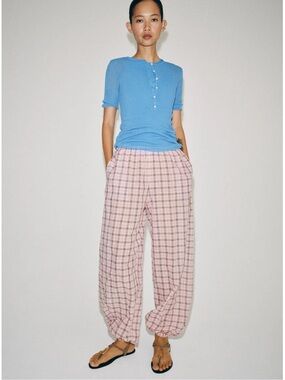 ZARA ZW Collection plaid balloon pants feature a mid-rise elastic waistband